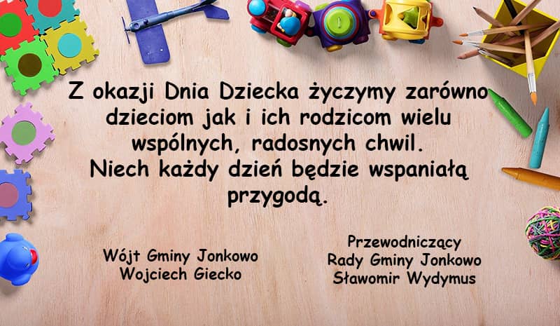 Grafika przedstawiająca rozrzucone zabawki oraz tekst życzeń, jak powyżej.